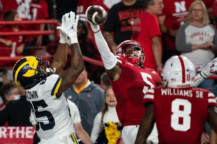 Oct 9, 2021; Lincoln, Nebraska, USA; Nebraska Cornhuskers cornerback Cam Taylor-Britt (5) breaks up a pass to Michigan Wolverines wide receiver Daylen Baldwin (85) during the second quarter at Memorial Stadium. Mandatory Credit: Dylan Widger-USA TODAY Sports
